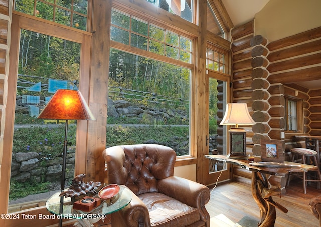 sunroom with vaulted ceiling and a wealth of natural light