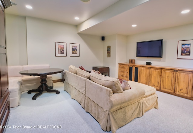 living room featuring light carpet