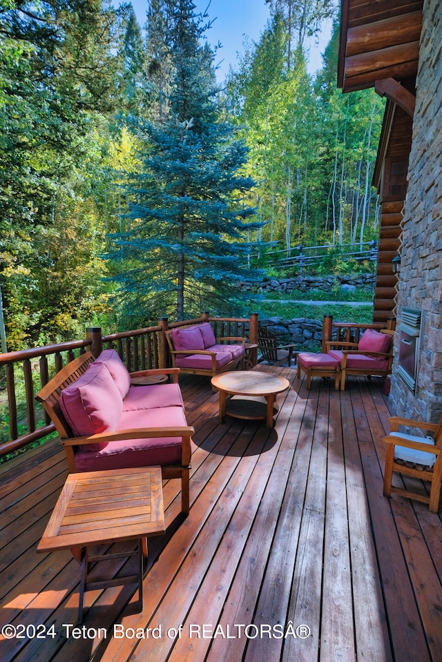 wooden deck featuring outdoor lounge area