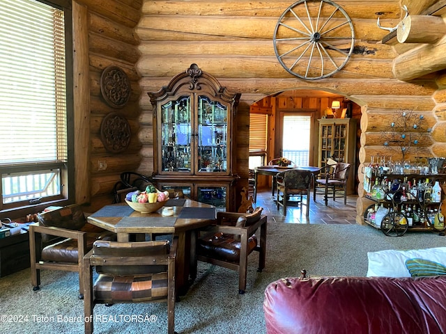 dining room with rustic walls