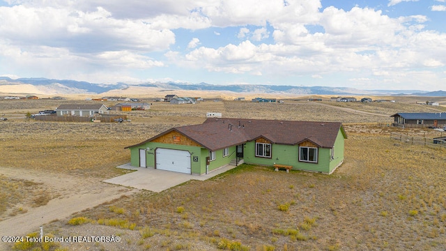 drone / aerial view featuring a mountain view