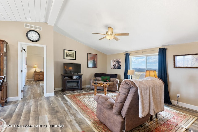 living room with vaulted ceiling with beams, ceiling fan, and hardwood / wood-style floors