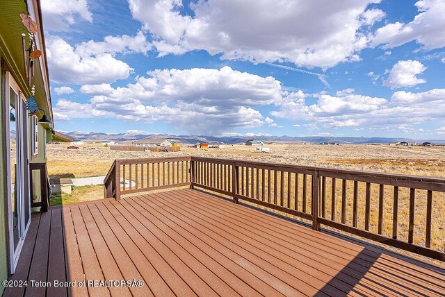 wooden terrace featuring a mountain view