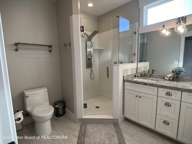 123 Creekside Ln, Swan Valley, ID 83449 - bathroom with vanity, a stall shower, toilet, baseboards, and recessed lighting