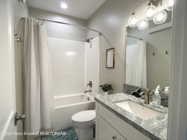 full bathroom featuring shower / bath combo, vanity, and toilet