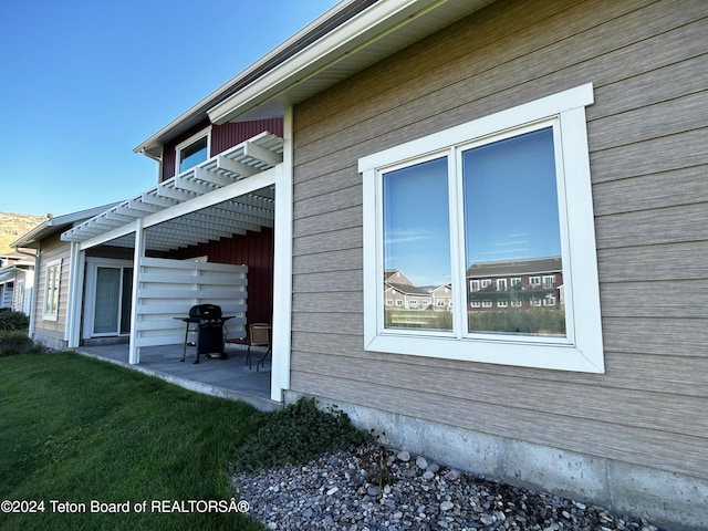 view of side of property with a patio