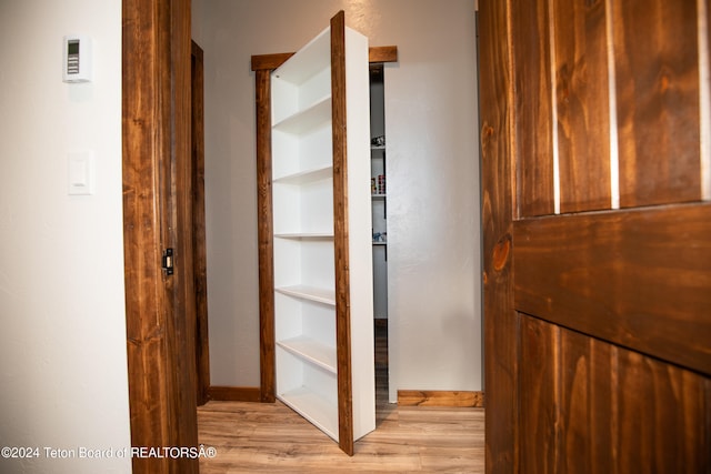 hall with light hardwood / wood-style flooring