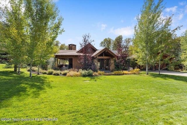 craftsman-style house with a front lawn