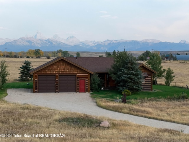4120 W 9500 N, Tetonia, ID 83452 - log cabin with a mountain view, a garage, and a rural view