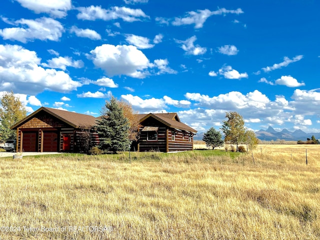 4120 W 9500 N, Tetonia, ID 83452 - log-style house with a mountain view, an outbuilding, and a rural view