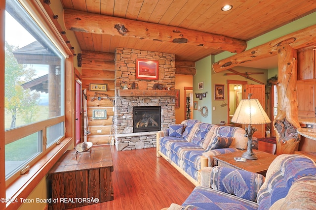 4120 W 9500 N, Tetonia, ID 83452 - living room featuring beam ceiling, hardwood / wood-style flooring, wooden ceiling, and a fireplace