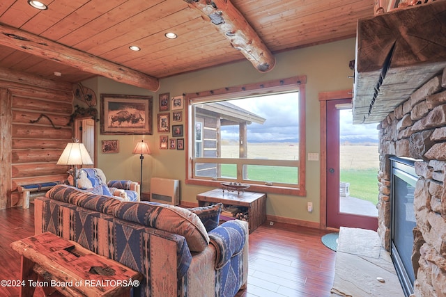 4120 W 9500 N, Tetonia, ID 83452 - living room featuring wood ceiling, beam ceiling, wood-type flooring, rustic walls, and a fireplace