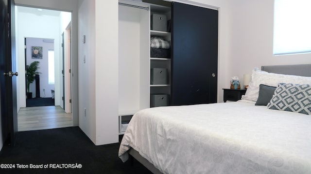 carpeted bedroom with a closet