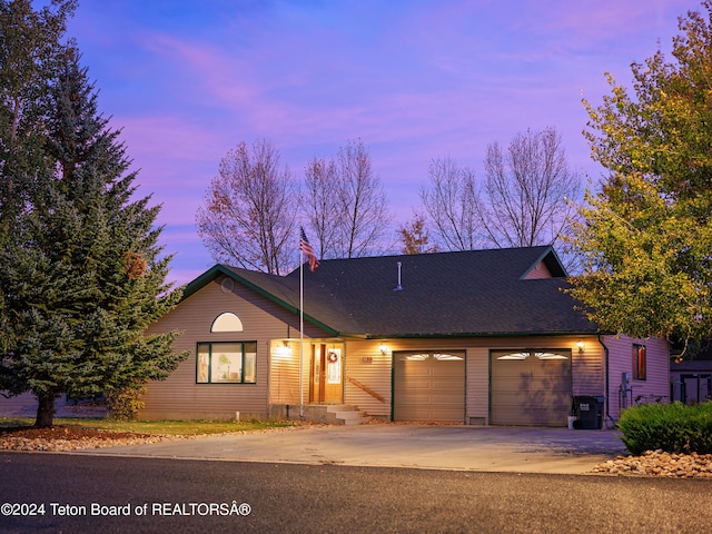 ranch-style house featuring a garage