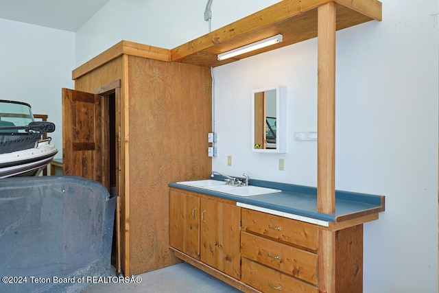 interior space with vanity and concrete floors