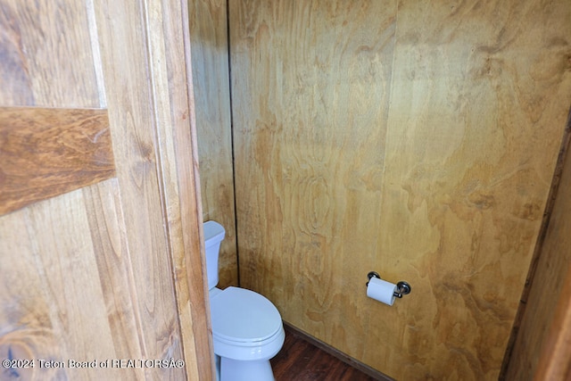 bathroom featuring hardwood / wood-style floors and toilet