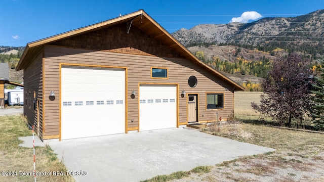 garage with a mountain view and wood walls