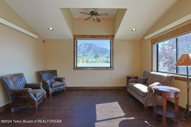 sitting room with dark hardwood / wood-style floors, vaulted ceiling, and ceiling fan