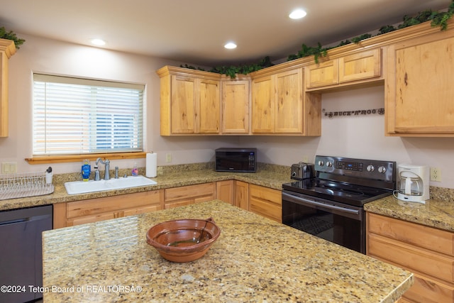 kitchen with black appliances, sink, light brown cabinets, and light stone countertops