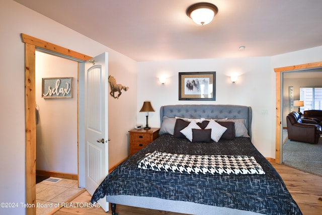 bedroom with wood-type flooring