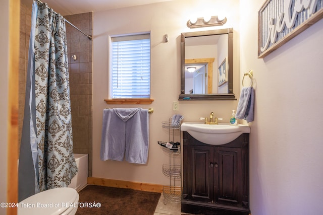 full bathroom featuring shower / bathtub combination with curtain, tile patterned floors, vanity, and toilet