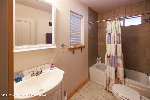 full bathroom featuring vanity, tile patterned flooring, toilet, and shower / bath combo