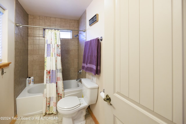 bathroom with tile patterned floors, shower / tub combo, and toilet