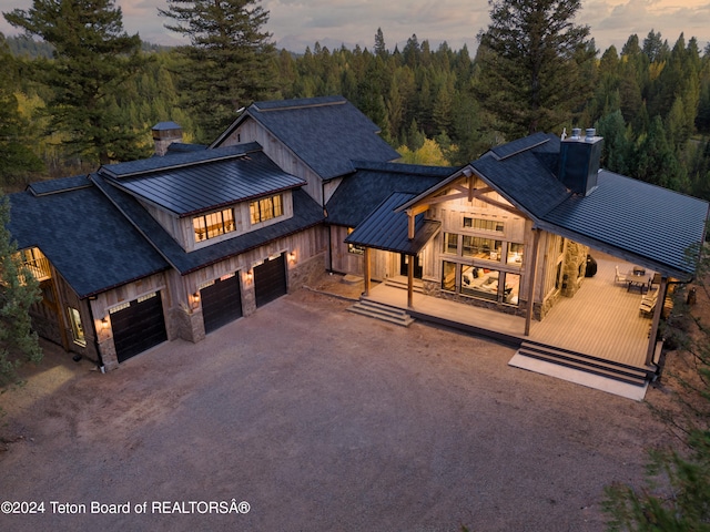 view of front of house with a garage and a wooden deck