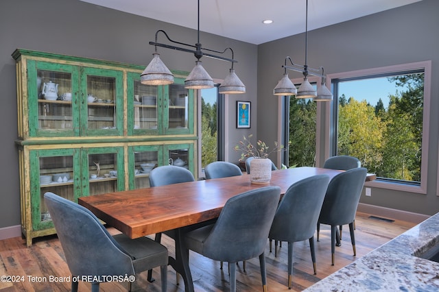 dining area featuring hardwood / wood-style flooring and a wealth of natural light