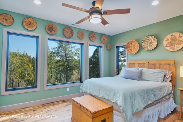 bedroom featuring ceiling fan and light hardwood / wood-style flooring