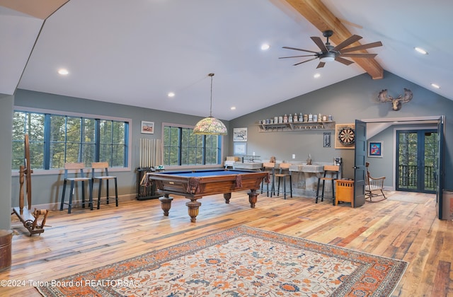 playroom featuring ceiling fan, billiards, light hardwood / wood-style flooring, vaulted ceiling with beams, and indoor bar