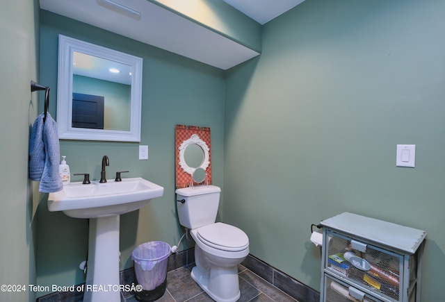 bathroom featuring tile patterned flooring and toilet