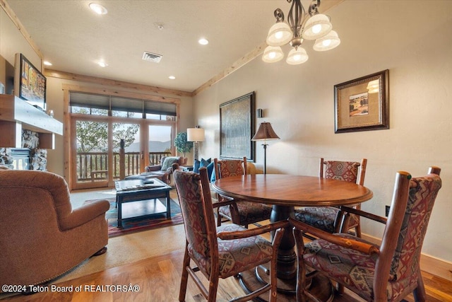 dining space featuring recessed lighting, visible vents, an inviting chandelier, and light wood-style floors