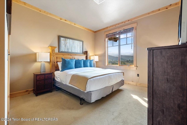 bedroom featuring baseboards, carpet floors, and ornamental molding