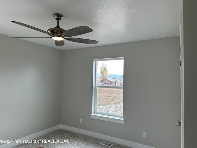 unfurnished room featuring ceiling fan