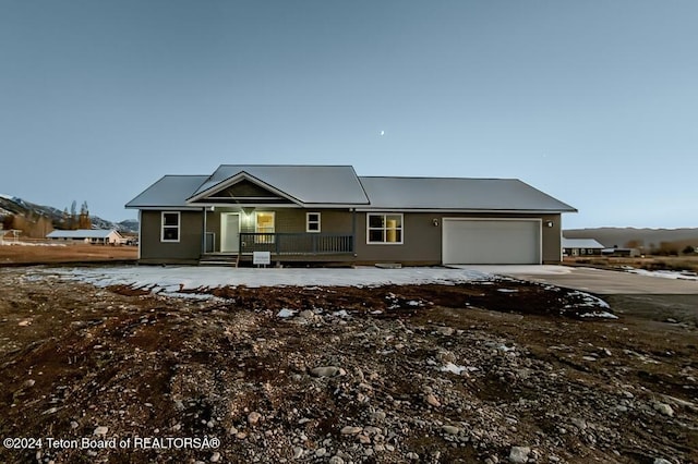 view of front of house with a garage and covered porch