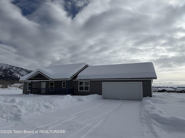 view of front of house featuring a mountain view and a garage