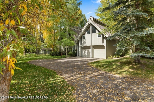 view of side of home featuring a garage