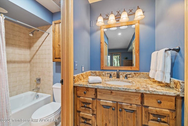 full bathroom with shower / bathtub combination with curtain, vanity, and toilet