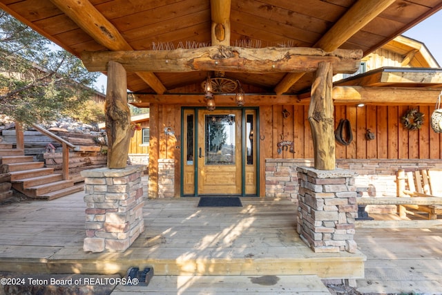 65 Bald Mountain Rd, Dubois, WY 82513 - view of exterior entry featuring board and batten siding and stone siding
