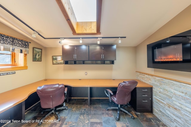 65 Bald Mountain Rd, Dubois, WY 82513 - office featuring rail lighting and dark stone finish floors