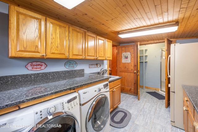 65 Bald Mountain Rd, Dubois, WY 82513 - washroom with washer and clothes dryer, wooden ceiling, and cabinet space