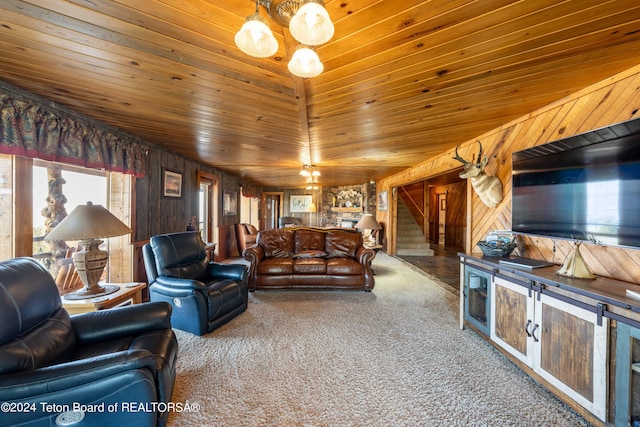 65 Bald Mountain Rd, Dubois, WY 82513 - carpeted living room featuring stairway, wood walls, and wooden ceiling