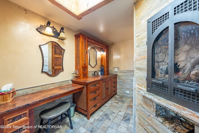 65 Bald Mountain Rd, Dubois, WY 82513 - bathroom featuring vanity and a wainscoted wall