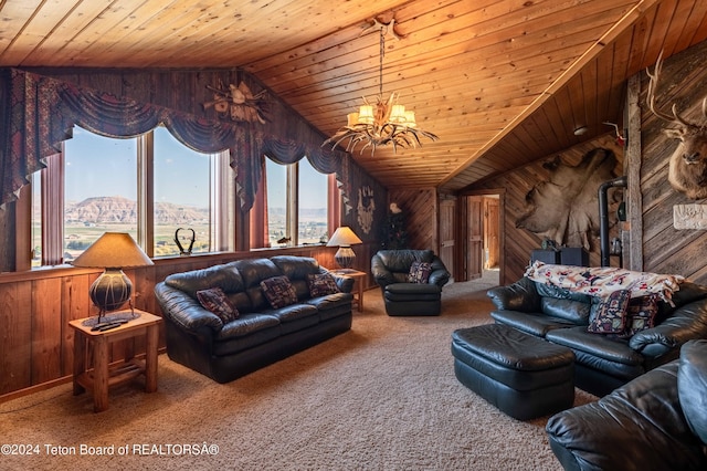 65 Bald Mountain Rd, Dubois, WY 82513 - carpeted living area with wood walls, lofted ceiling, a chandelier, and wooden ceiling