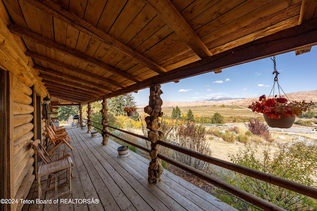 wooden deck with a mountain view