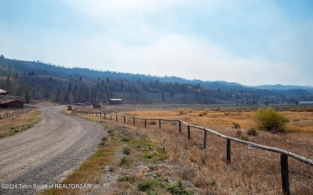 view of road with a mountain view and a rural view