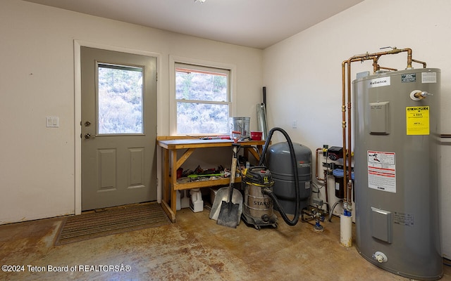 utility room featuring water heater