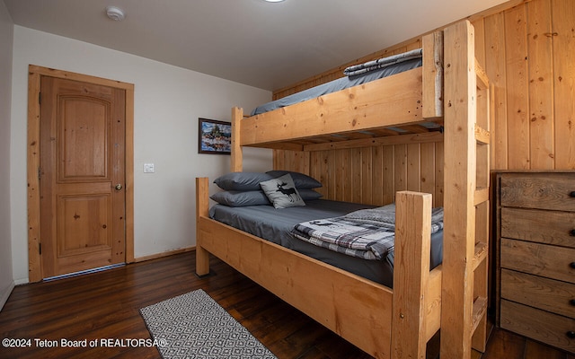 bedroom featuring dark wood-type flooring