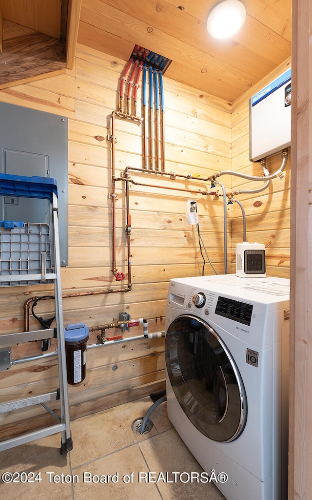 laundry area with wooden walls, tile patterned flooring, wooden ceiling, and washer / dryer